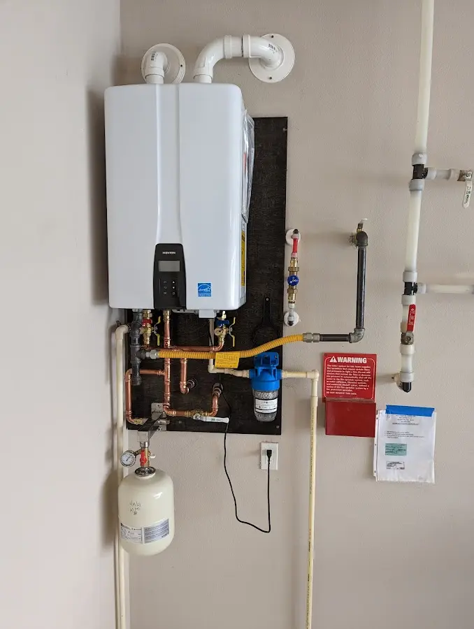 Professional plumber installing copper piping in a Chula Vista home